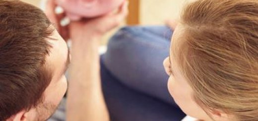 couple looking at piggy bank