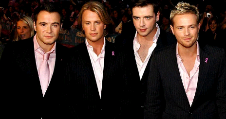 The image shows what the used to be young boys now look like, a picture taken after the announcement that they are re-uniting for a music tour.